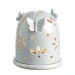 Handmade ceramic holder with butterfly decoration and cut-out design