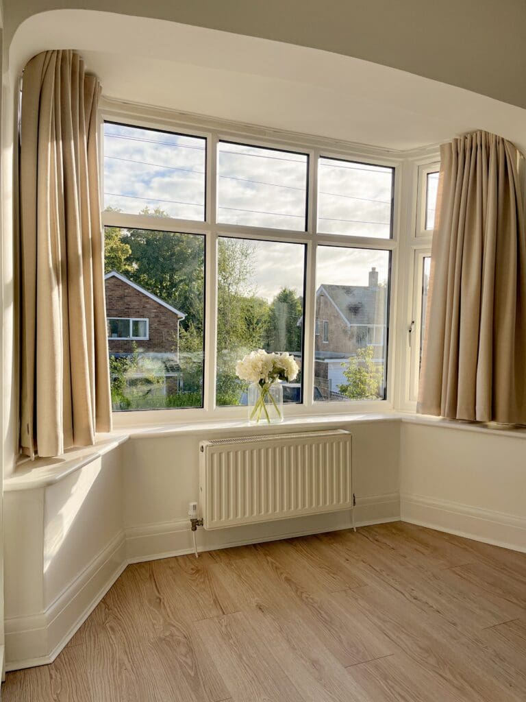 @insidesarahshome - Paleo Linen Sandstone Curtains with window sill length in a living room in a bay winow